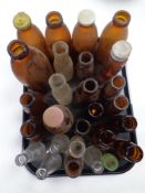 A tray of assorted glass bottles : Campri soda