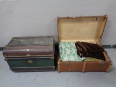 An early 20th century tin trunk together with a further wooden bound trunk