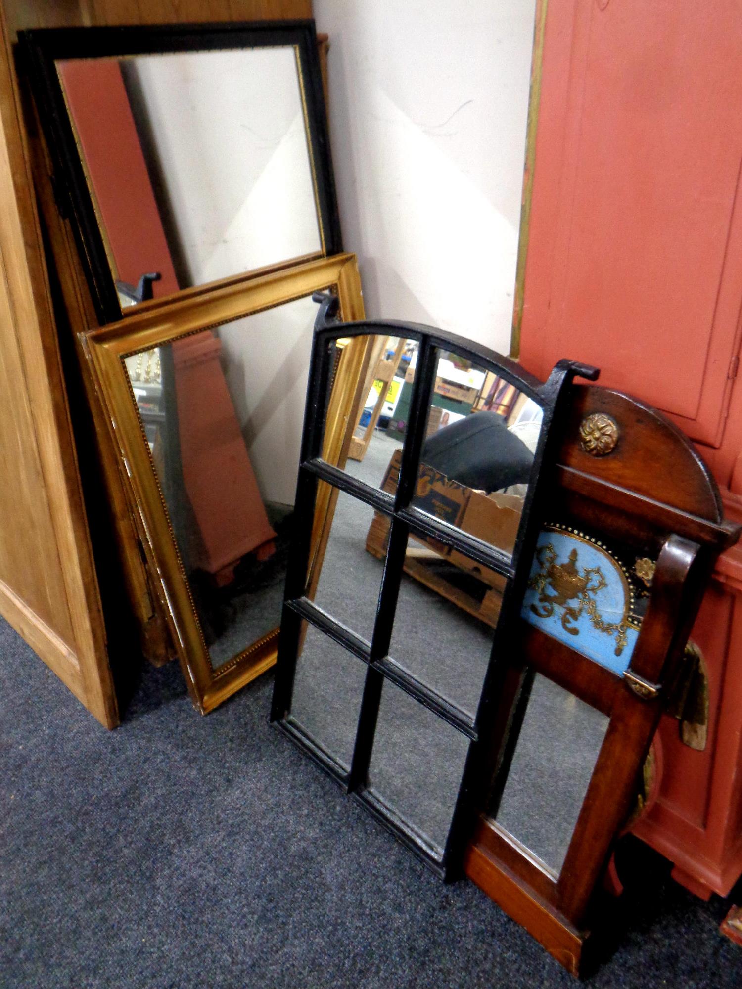 A 19th century mahogany mirror and glass panel, framed as one,
