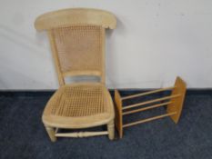 An Edwardian bergere nursing chair and a shoe rack