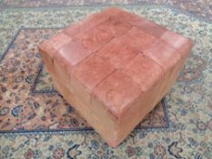 A 20th century leather foot cube