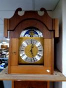 A continental longcase clock with moonphase dial