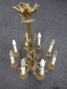 An antique gilt metal eight branch chandelier