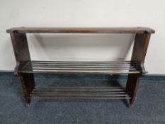 A 20th century three tier shoe rack and an occasional table