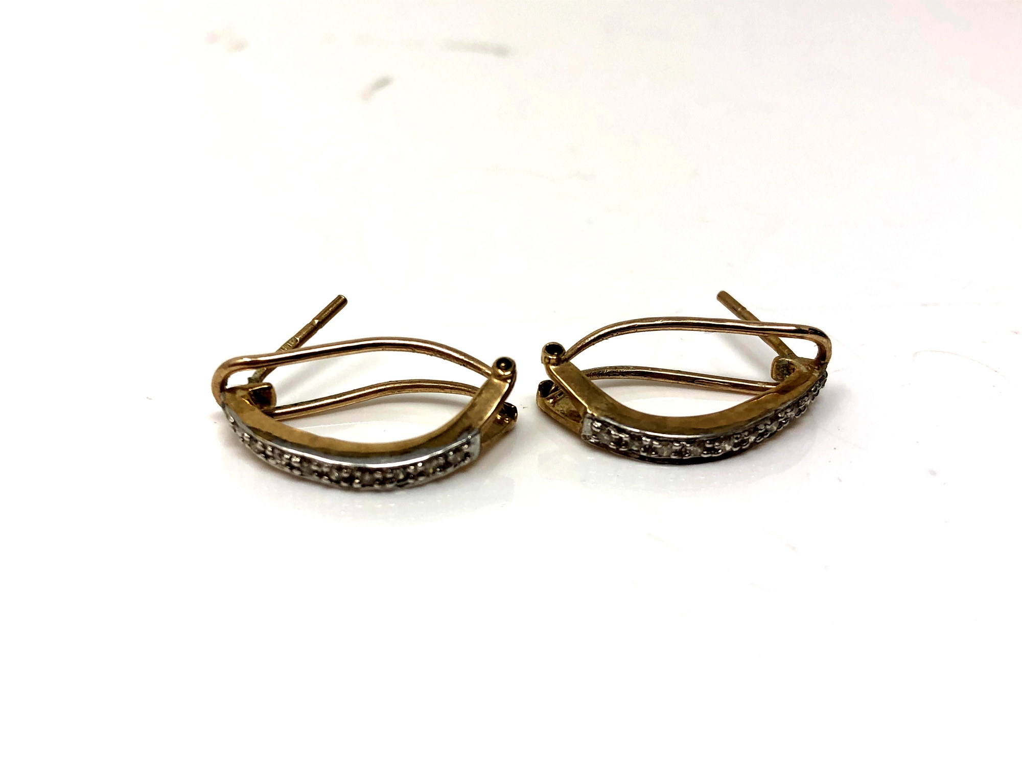 A pair of 9ct gold diamond set earrings. CONDITION REPORT: 2.