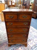 A Georgian style inlaid mahogany six drawer chest (foot damaged)