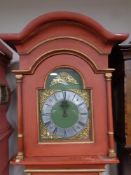 A 19th century continental painted longcase clock with brass and metal dial,