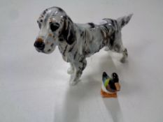 A Royal Doulton figure of a setter together with a further figure of a duck.