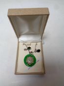 A silver and jade pendant together with nephrite jade earrings.