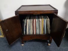 A mid 20th century record cabinet containing LP records : classical and orchestral