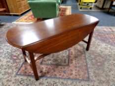 A continental mahogany flap sided coffee table