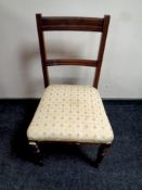 An Edwardian carved mahogany dining chair