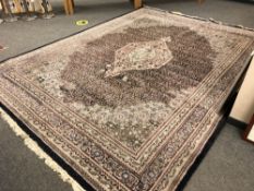 A Tabriz design carpet, 295 x 390 cm CONDITION REPORT: Moth damage in areas.