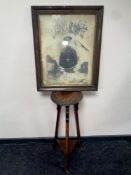 An Edwardian plant stand on tripod legs and an antiquarian print "United to Conquer"