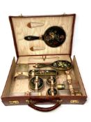 A crocodile leather-cased silver-gilt and hand-painted dressing table part-set retailed by