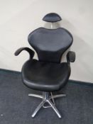 A hydraulic barber's armchair