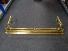 A Victorian brass fire fender