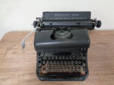 A vintage Remington typewriter and cover