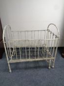 An antique wrought iron cot bed