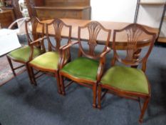 A set of eight reproduction Hepplewhite style dining chairs