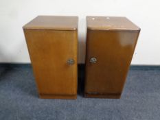 A pair of mid 20th century bedside cabinets in an oak finish