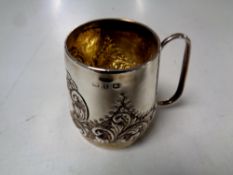 A silver embossed Christening mug, Walker & Hall, date letter rubbed.