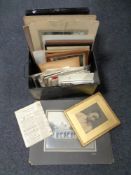 An early 20th century metal deed box containing black and white antiquarian pictures,