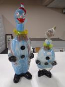 Two graduated Murano glass clown decanters,