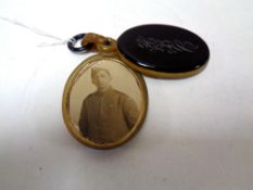 A WWI memorial locket initialled 'HBC'.