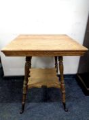 An Edwardian oak occasional table.