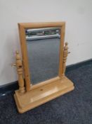 A stripped pine vanity mirror