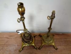 A pair of antique brass lamp bases.