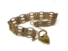 A 9ct gold padlock bracelet. CONDITION REPORT: 18.