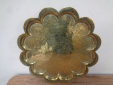 An antique Indian shaped brass tray