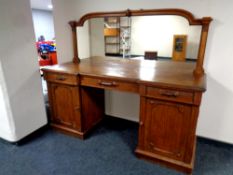 A 19th century oak pedestal mirror backed sideboard