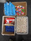 Three boxes of Christmas novelties : bouncy balls, wrist snappers,