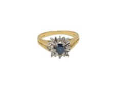 An 18ct gold sapphire and diamond cluster ring, size M CONDITION REPORT: 3.