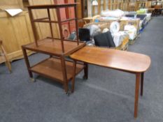 A mid 20th century teak two tier trolley together with a further teak coffee table and occasional