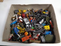 A box of assorted toys to include 20th century play worn die cast vehicles, tank tracks etc.