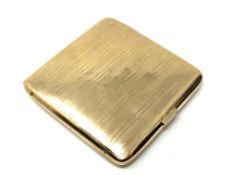 A gold cigarette case, marks rubbed, presumed 9ct gold, 8cm by 8cm.