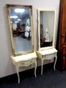 A white and gilt one drawer console table with mirror together with a similar cream and gilt one