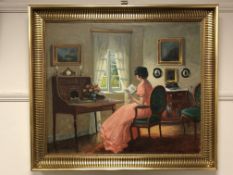 Continental school : A lady reading by a desk, oil on canvas,