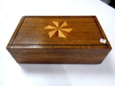 An antique inlaid trinket box with flower embroidery insert