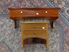 A mahogany wall shelf fitted two drawers and a further miniature chest