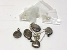 Five silver lockets on chains