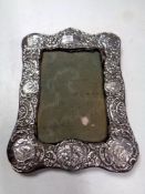 An antique silver photo frame (hallmarks rubbed)