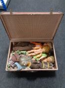 A mid 20th century luggage case containing dolls