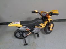 A child's electric ride on moto cross bike with stabilisers