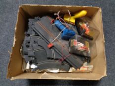A box of Scalextric and two Grand Prix Scalextric cars