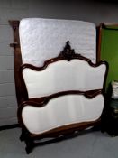 A carved antique 4ft 6 French bed frame with base and interior